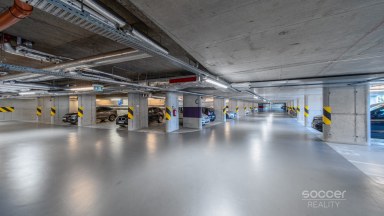 Prodej loftového bytu 1+kk s balkonem, sklepem a garážovým stáním – Bydlení na Krejcárku, Praha 9